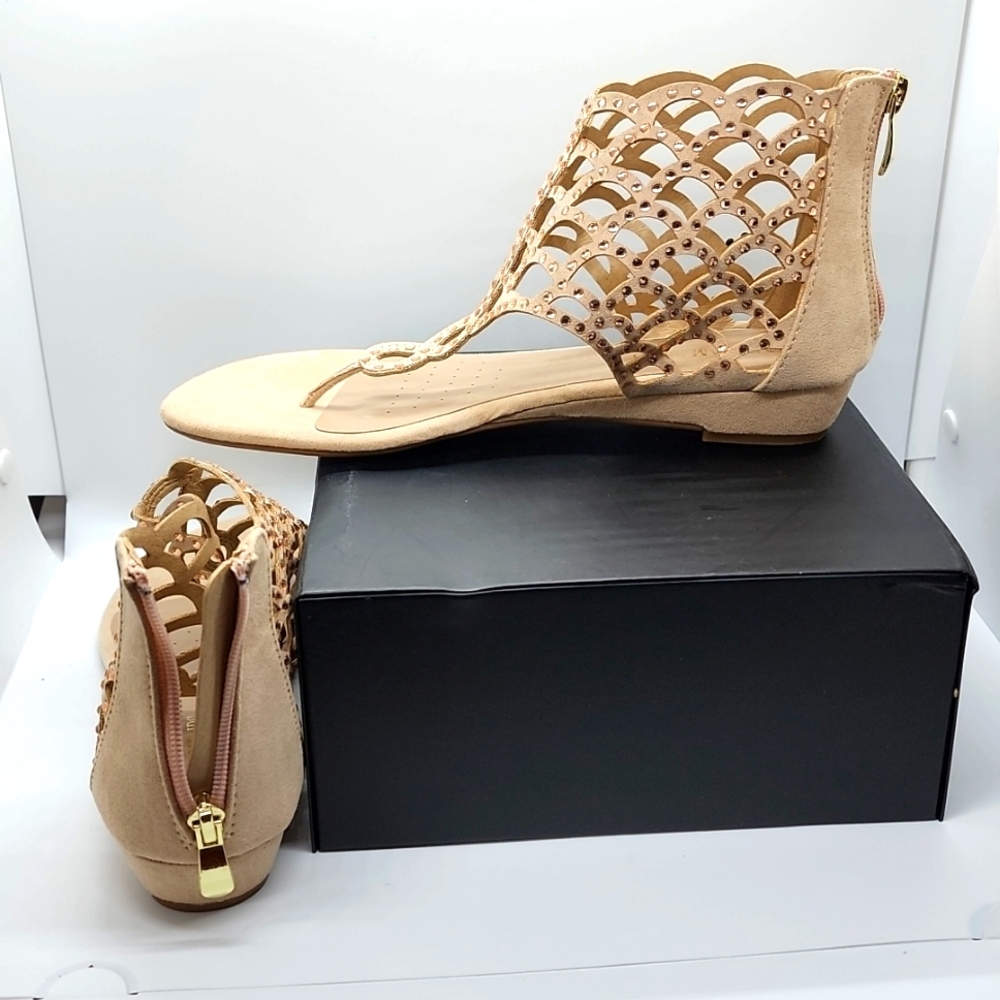 I'm selling a pair of Dream Pairs scalloped rhinestone zipper heel flat sandals.